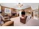 Open living room with brick fireplace and ample seating at 6103 Governors Walk Dr, Canton, GA 30115