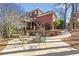 Large patio with fire pit and seating area, near home at 6103 Governors Walk Dr, Canton, GA 30115