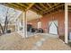 Covered patio with seating area and wooded views at 6103 Governors Walk Dr, Canton, GA 30115