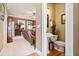 Convenient powder room with pedestal sink and toilet at 6103 Governors Walk Dr, Canton, GA 30115