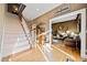 Bright entryway with hardwood floors and elegant staircase at 6103 Governors Walk Dr, Canton, GA 30115