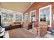 Relaxing sunroom with brick walls and a seating area at 6103 Governors Walk Dr, Canton, GA 30115