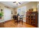 Bright sunroom features hardwood floors and a ceiling fan at 6103 Governors Walk Dr, Canton, GA 30115