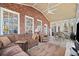 Sunroom offers a seating area and access to outdoor deck at 6103 Governors Walk Dr, Canton, GA 30115
