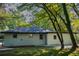 Private backyard with mature trees and grassy lawn at 1807 W Austin Rd, Decatur, GA 30032