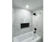 Clean bathroom with marble shower, bathtub, and black accents at 1807 W Austin Rd, Decatur, GA 30032