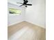 Bright bedroom with ceiling fan, window, and light wood-look flooring at 1807 W Austin Rd, Decatur, GA 30032