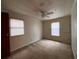 Well-lit bedroom featuring carpet and window blinds at 3520 Haynes Ridge Rd, Loganville, GA 30052