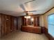 Dining room with wood-paneled walls and built-in hutch at 3520 Haynes Ridge Rd, Loganville, GA 30052