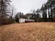 Mobile home in wooded area, large yard at 3520 Haynes Ridge Rd, Loganville, GA 30052