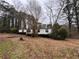 Side view of a mobile home with a deck at 3520 Haynes Ridge Rd, Loganville, GA 30052