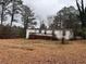 Back of the mobile home, showing deck and yard at 3520 Haynes Ridge Rd, Loganville, GA 30052