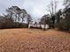 Mobile home with a large yard and trees at 3520 Haynes Ridge Rd, Loganville, GA 30052