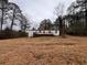 Mobile home with deck, large yard and trees at 3520 Haynes Ridge Rd, Loganville, GA 30052