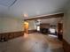 Living room with fireplace and wood paneled walls at 3520 Haynes Ridge Rd, Loganville, GA 30052