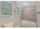 Updated bathroom with tub/shower combo and neutral tile at 4761 Lincoln Ne Dr, Kennesaw, GA 30144