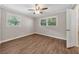 Well-lit bedroom with wood-look floors and ceiling fan at 4761 Lincoln Ne Dr, Kennesaw, GA 30144