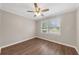 Spacious bedroom with wood-look floors and ceiling fan at 4761 Lincoln Ne Dr, Kennesaw, GA 30144