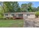 Ranch style home with a large deck and spacious yard at 4761 Lincoln Ne Dr, Kennesaw, GA 30144