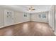 Spacious living room featuring wood-look floors and a ceiling fan at 4761 Lincoln Ne Dr, Kennesaw, GA 30144