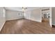 Open living room with wood-look floors, leading to kitchen at 4761 Lincoln Ne Dr, Kennesaw, GA 30144