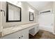 Double vanity bathroom with granite countertop and tile flooring at 7124 Big Woods Dr, Woodstock, GA 30189