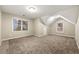 Bright bedroom featuring a vaulted ceiling and carpet flooring at 7124 Big Woods Dr, Woodstock, GA 30189