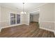 Formal dining room with hardwood floors and chandelier at 7124 Big Woods Dr, Woodstock, GA 30189