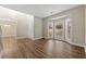 Bright living room with hardwood floors and bay windows at 7124 Big Woods Dr, Woodstock, GA 30189