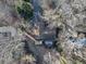 House with deck and driveway, viewed from above among winter trees at 2545 Kingswood Dr, Marietta, GA 30066