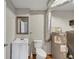 Utility bathroom with a vanity sink, toilet, and a vintage framed mirror and tile flooring at 2545 Kingswood Dr, Marietta, GA 30066