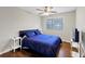 Bedroom with a large window, hardwood floors, and simple furnishings at 2545 Kingswood Dr, Marietta, GA 30066