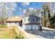 Gray two-story home with a two car garage and a light brown roof at 2545 Kingswood Dr, Marietta, GA 30066