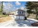 Gray two-story home with a two car garage and a light brown roof at 2545 Kingswood Dr, Marietta, GA 30066