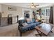 Cozy living room featuring a futon, entertainment center, and neutral-toned walls and carpet at 2545 Kingswood Dr, Marietta, GA 30066