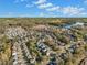 Aerial view of a residential neighborhood with houses and a lake at 308 Evening Rain Crst, Canton, GA 30114