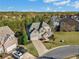 Aerial view of a two-story house with a yard and driveway at 308 Evening Rain Crst, Canton, GA 30114