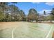 Outdoor basketball court with surrounding trees at 308 Evening Rain Crst, Canton, GA 30114