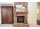 Stone fireplace with a mantel, adding warmth to the home at 308 Evening Rain Crst, Canton, GA 30114