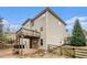 Two-story house with deck, fenced yard, and mature trees at 308 Evening Rain Crst, Canton, GA 30114