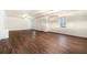 Large living room featuring dark brown wood flooring at 308 Evening Rain Crst, Canton, GA 30114