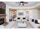 Light-filled living room with stone fireplace and comfortable seating at 308 Evening Rain Crst, Canton, GA 30114