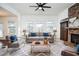 Virtually staged living room with stone fireplace and comfy seating at 308 Evening Rain Crst, Canton, GA 30114