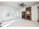 Living room with a stone fireplace and large windows at 308 Evening Rain Crst, Canton, GA 30114