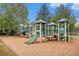 playground with slides, climbing structures, and wood-chip surface at 308 Evening Rain Crst, Canton, GA 30114