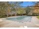 Community pool with pool cover and surrounding trees at 308 Evening Rain Crst, Canton, GA 30114