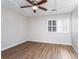 Bright bedroom with wood floors and window shutters at 557 Summit Sw Ln, Marietta, GA 30008