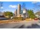 Tan two-story home with brick chimney at 557 Summit Sw Ln, Marietta, GA 30008