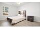 Bright bedroom with double bed, nightstand, and large window at 2600 Laurel Nw Ln, Kennesaw, GA 30152