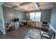 Formal dining room with hardwood floors and decorative ceiling beams at 430 St Annes Pl, Covington, GA 30016